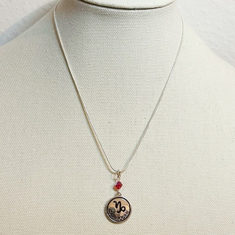 Capricorn Zodiac Pendant Necklace with Red Accent